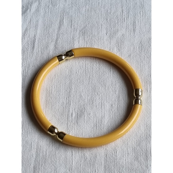 Ubrukt armbånd fra 1980 til 1990-tallet, gult med pynt