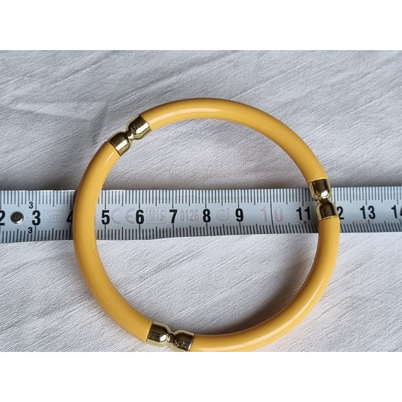 Ubrukt armbånd fra 1980 til 1990-tallet, gult med pynt