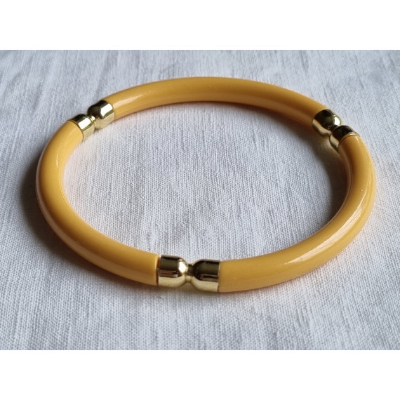 Ubrukt armbånd fra 1980 til 1990-tallet, gult med pynt